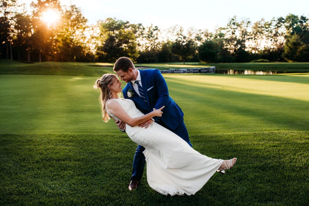 Couple taking golden hour wedding portraits during sunset on their Ottawa wedding day