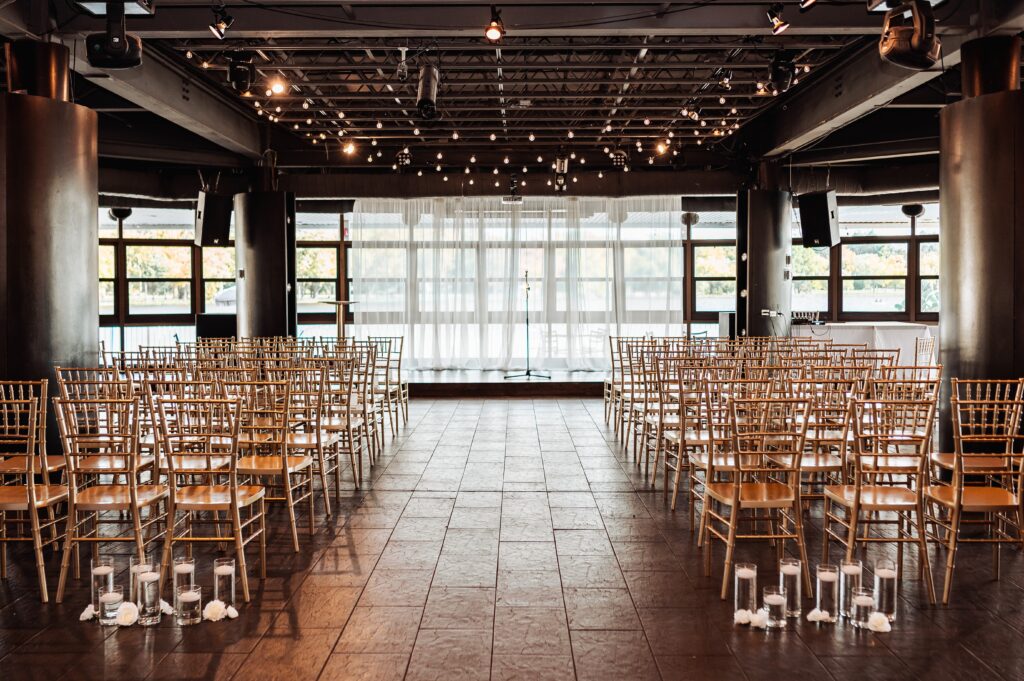Wedding ceremony setup inside Lago wedding venue overlooking Dow’s Lake in Ottawa