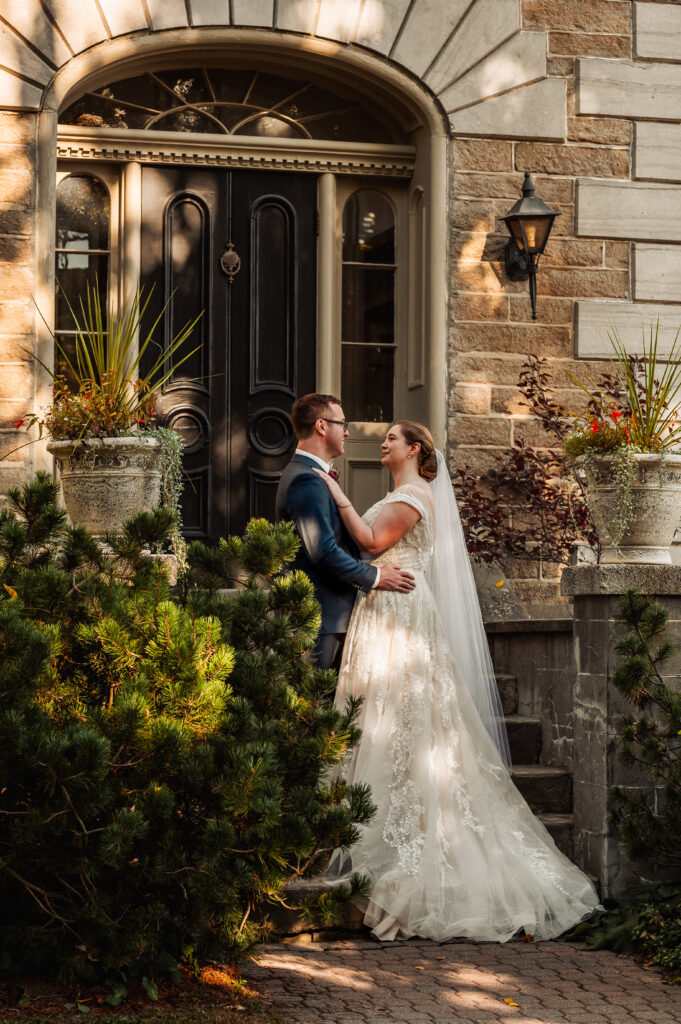 Couple sharing a portrait outside a historic wedding venue at Strathmere Weddings Estate