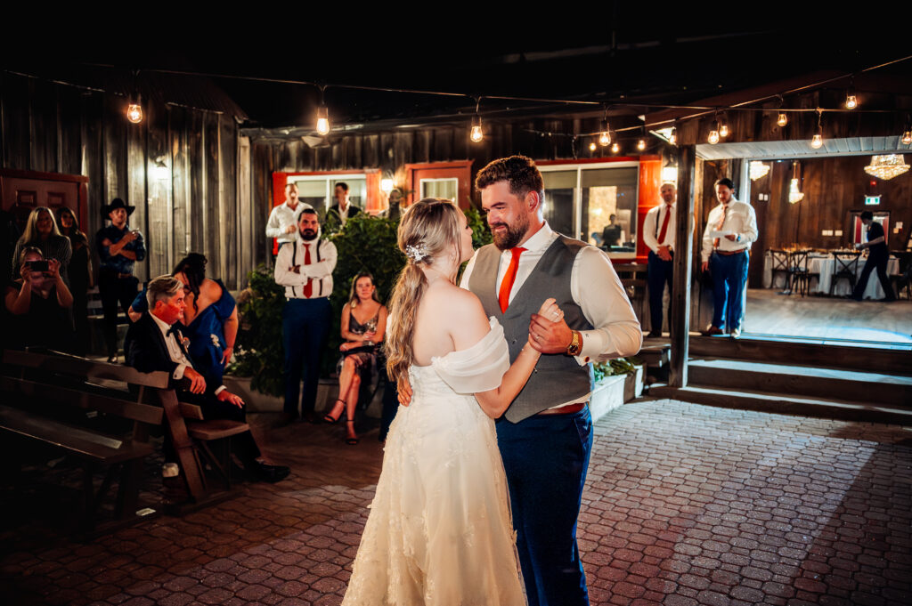 Couple dance on outdoor dance floor of Strathmere Lodge