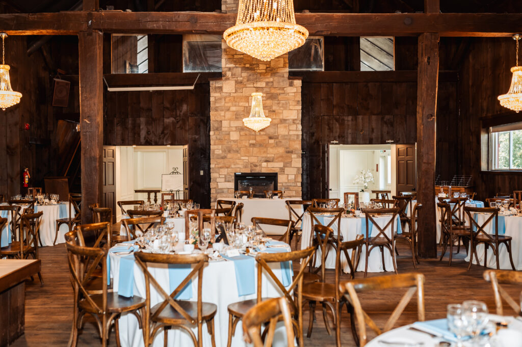 Indoor reception space at Strathmere Weddings Estate with exposed beams and stone fireplace
